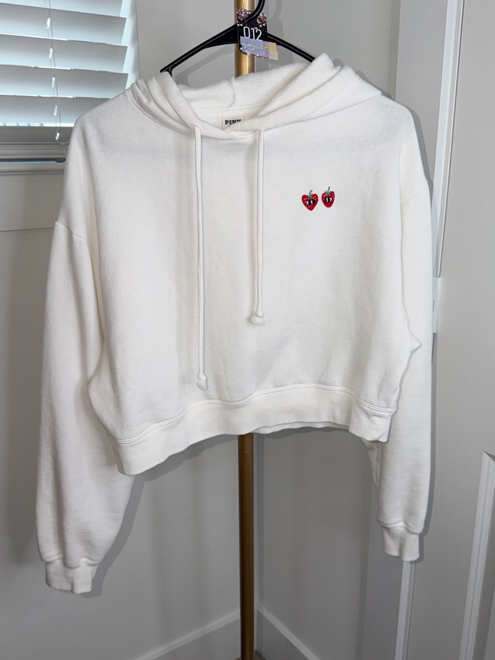 12. PINK Victoria's Secret White Cropped Hoodie with Red Strawberry Embroidery